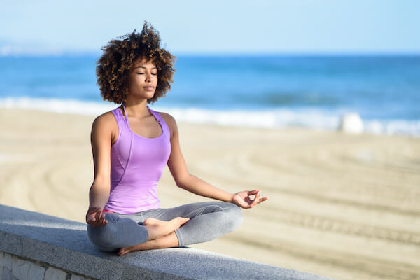 Woman enjoying yoga to support her mental and physical health while she is grieving